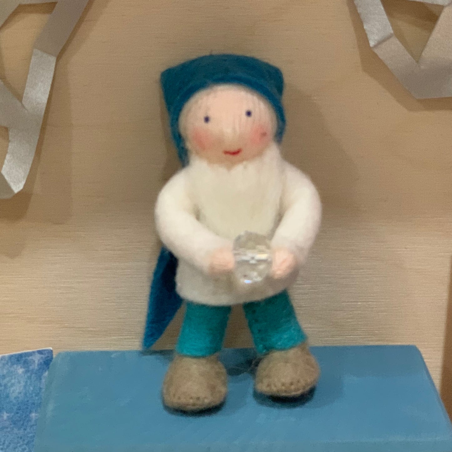 Ambrosius small felt fairy folk Winter gnome in blue and white, holding a crystal