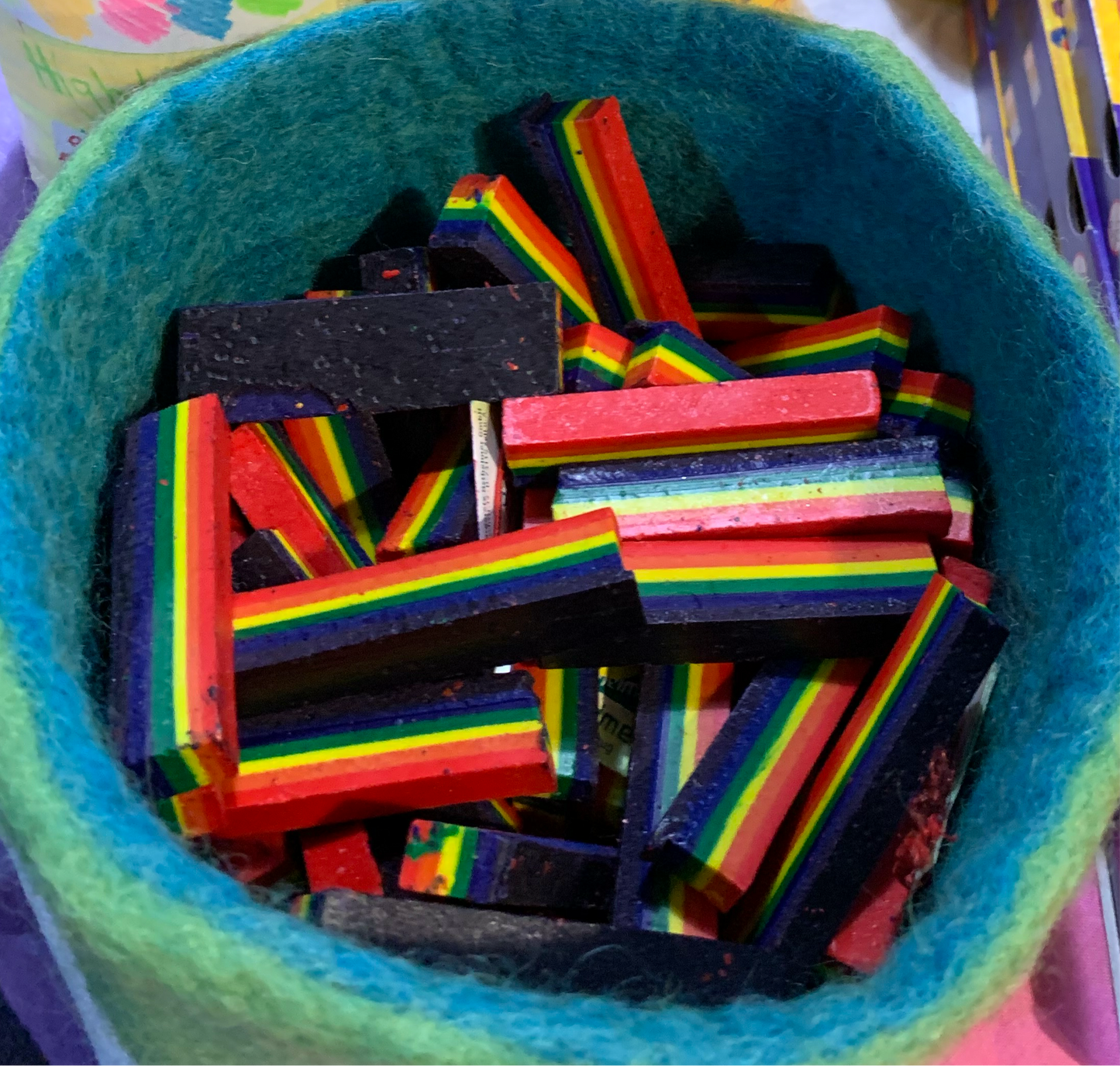 A bowl of Rainbow wax crayon sticks