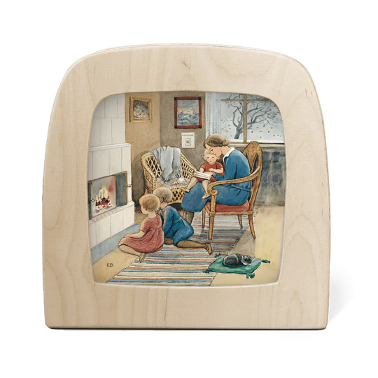 a toverlux silhouette screen depicting a mother sitting reading to three children by the fireside with a cat asleep on a cushion in the foreground