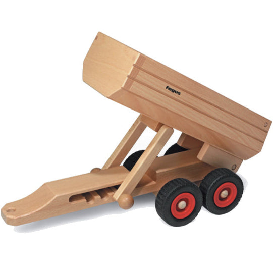Wooden toy dump truck with red wheels on a white background
