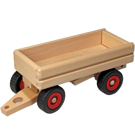 Wooden toy trailer with black wheels and red hubs on a white background