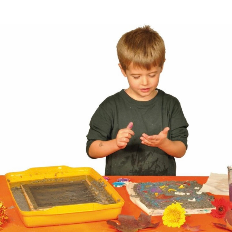 Child making hand made paper