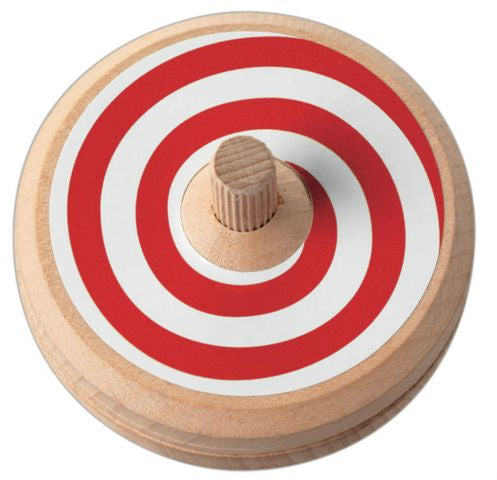 Wooden disc with red and white spiral on a white background