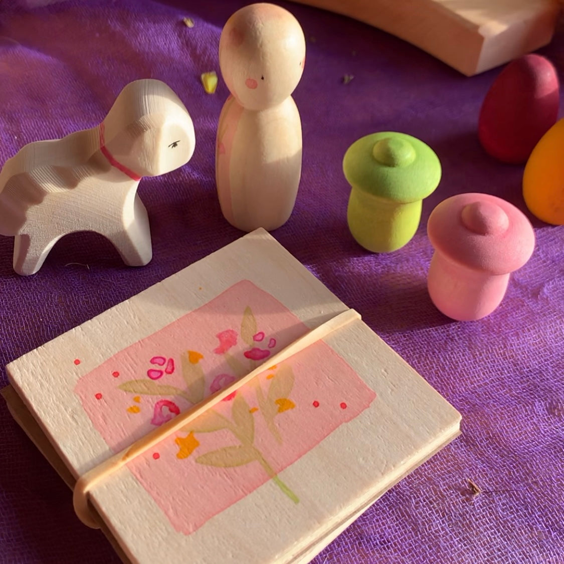 Hello Spring Grapat X Ostheimer colab of hand made wooden pieces includes a little lamb, two tulip flowers, a Lady Spring, and a hand decorated flower press.