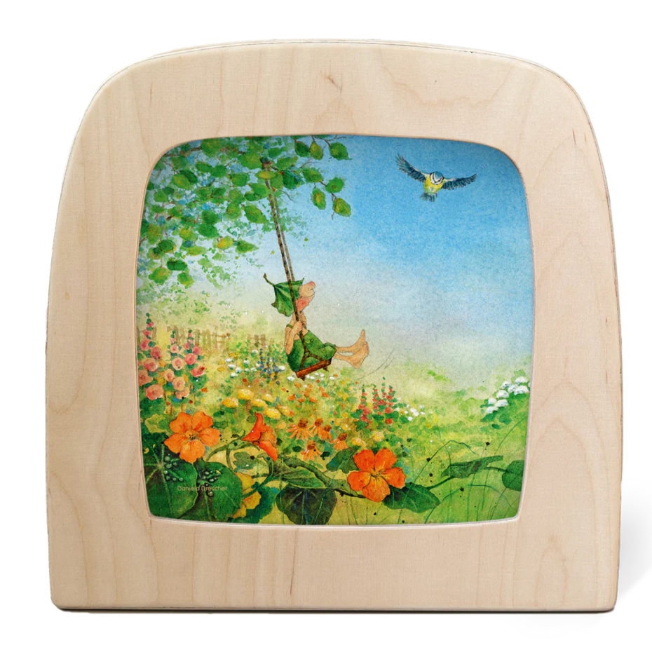 Griswald the Gnome is swinging in the garden on a bright sunny day