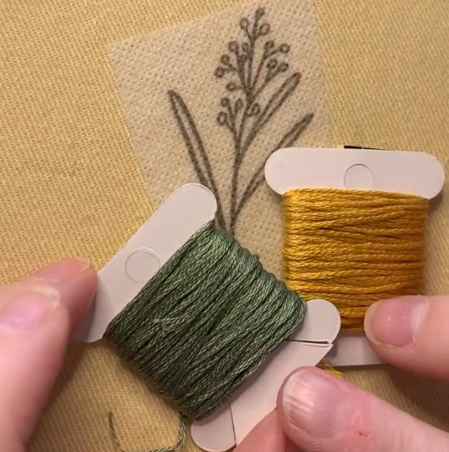 a close up of Juliette choosing colours for the wattle design in her 'Australian Native Florals' kits