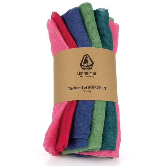 Set of colorful muslin fabrics in fairytale shades with a brand label on a white background