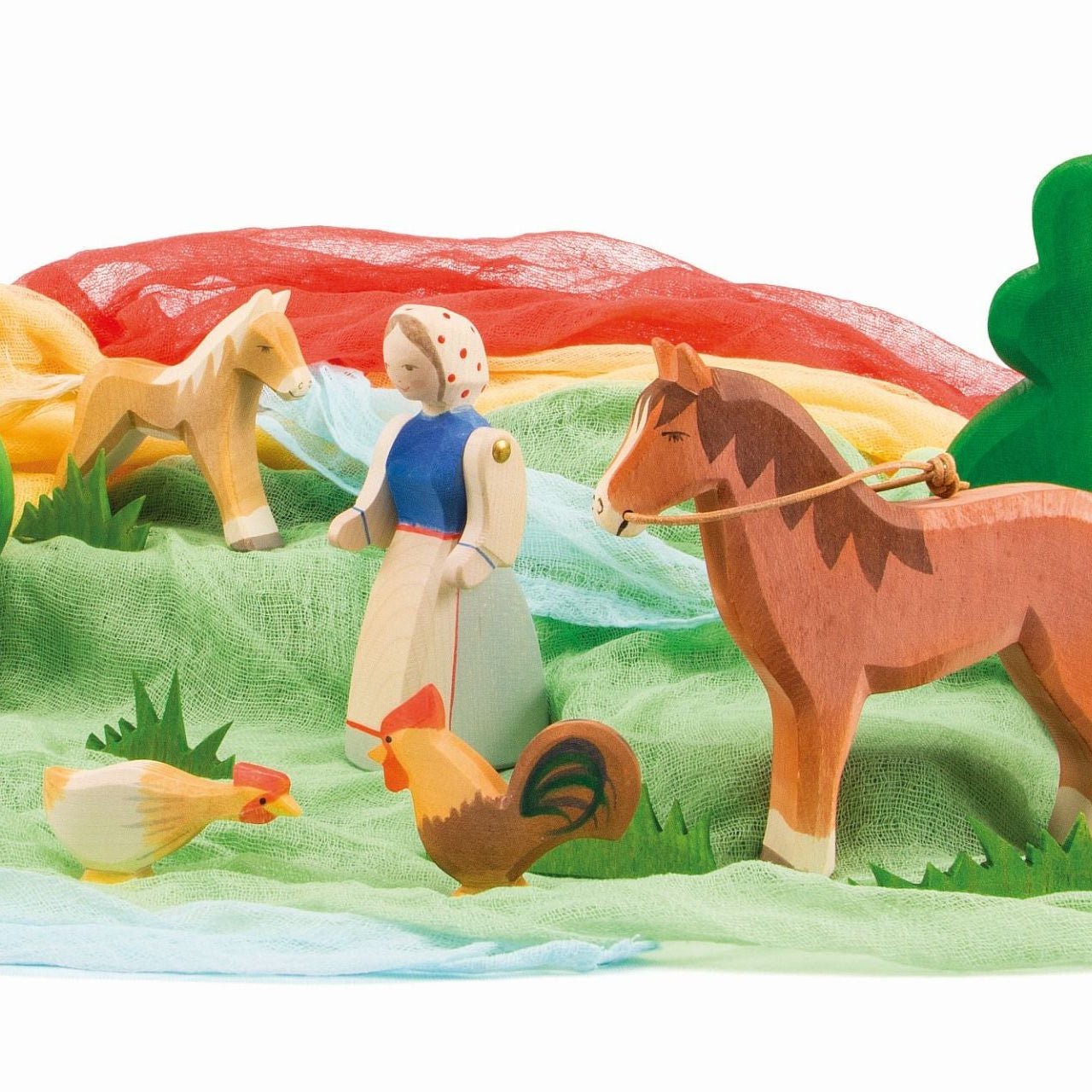 Wooden toy set with a lady farmer, horses, and chickens on a colorful landscape.