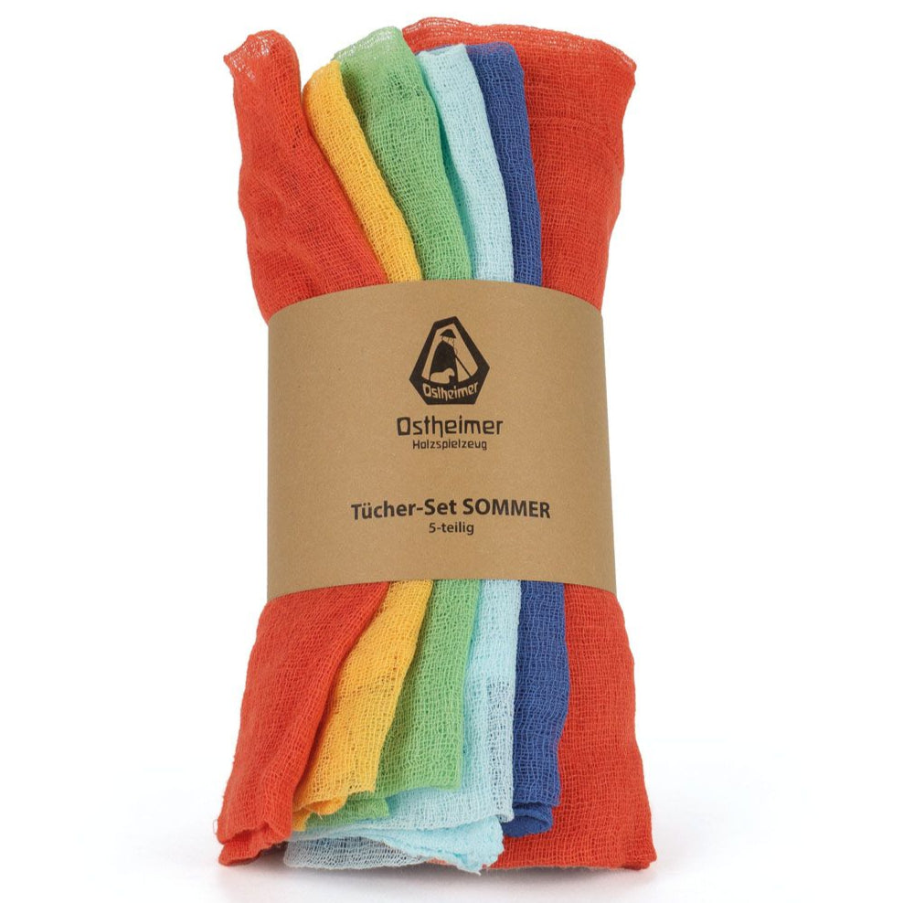 Set of colorful muslin cotton fabrics with a branded label on a white backgroundi