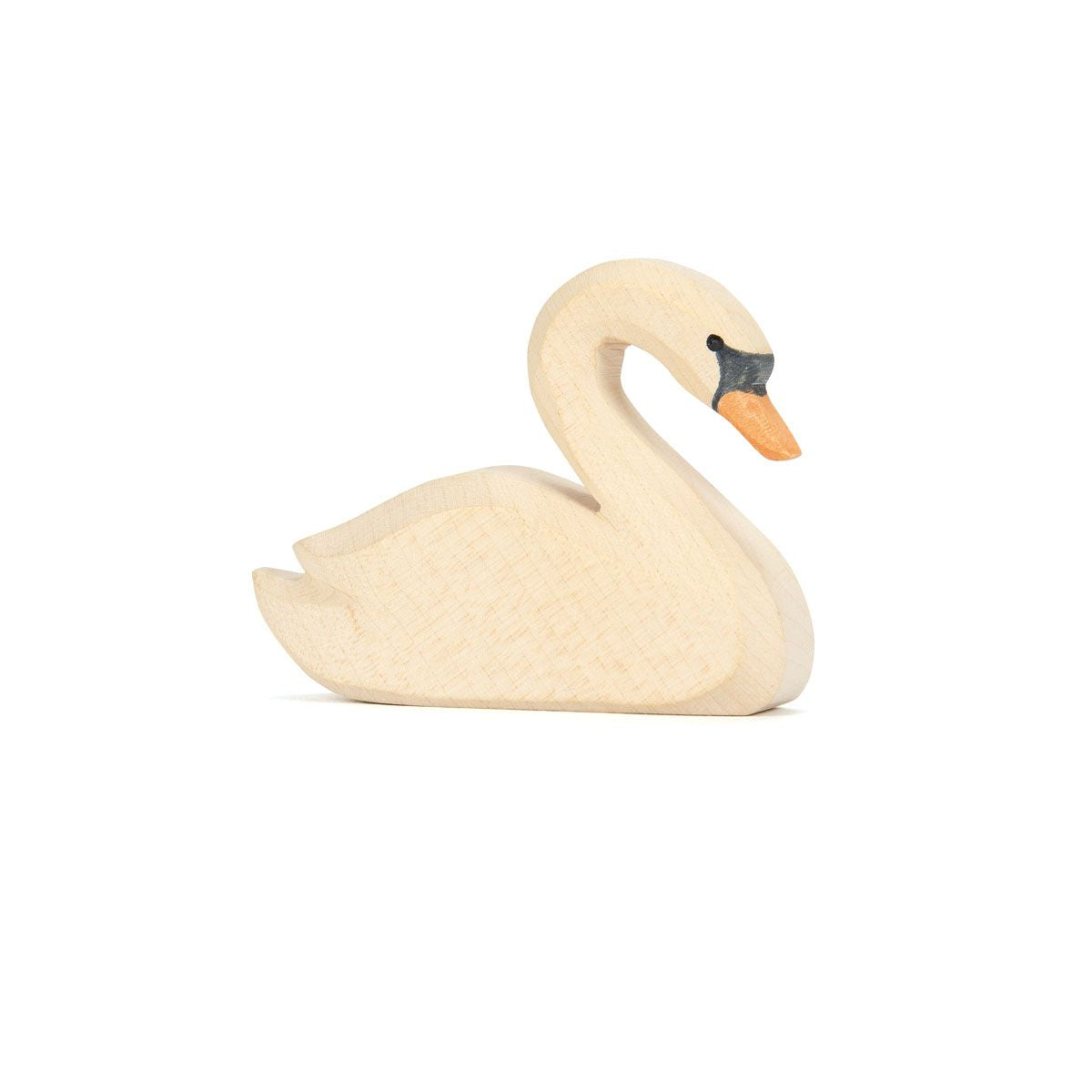A wooden swan figures placed against a white background.