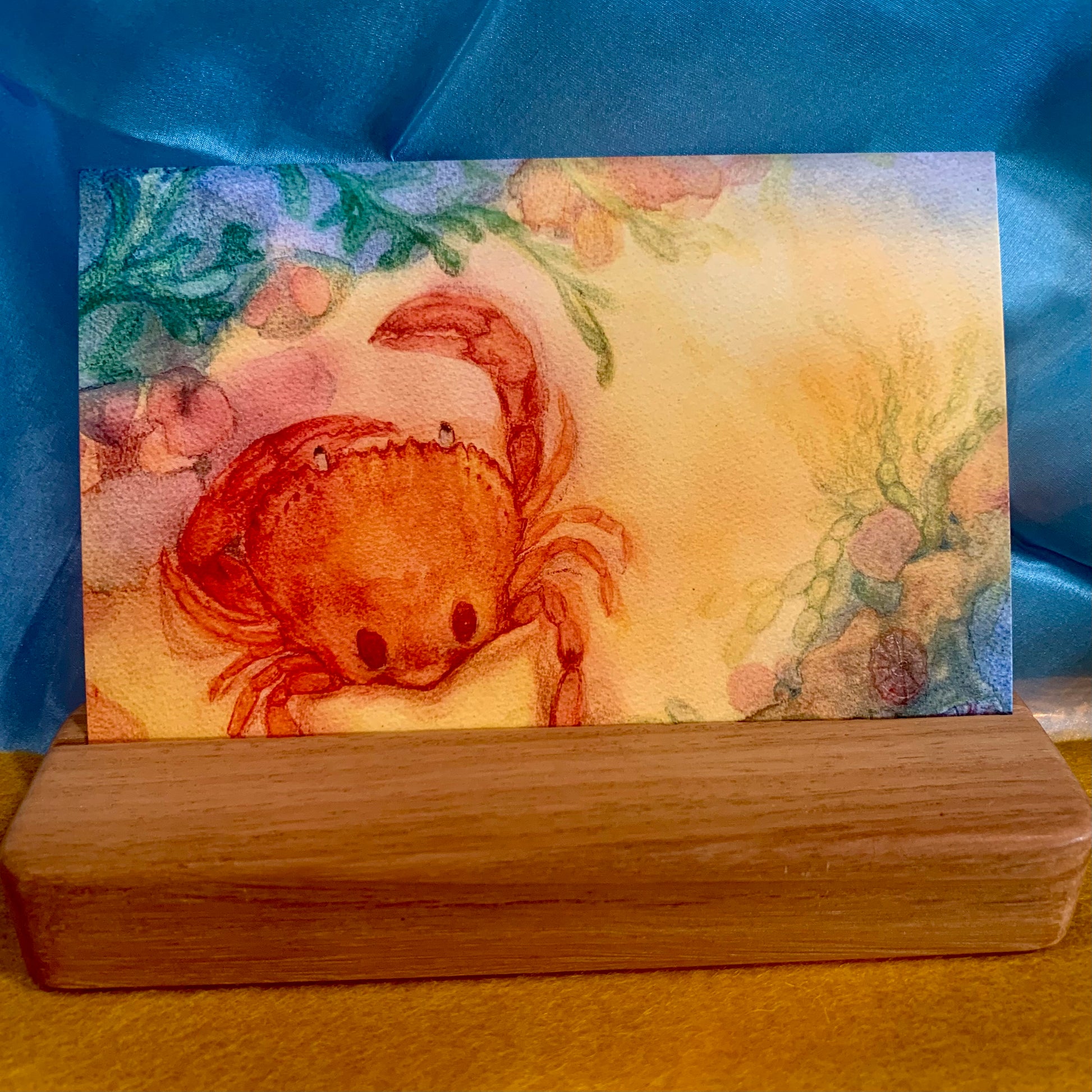 Summer post card by Bronte of a Sand Crab, displayed in a wooden card stand (sold separately)