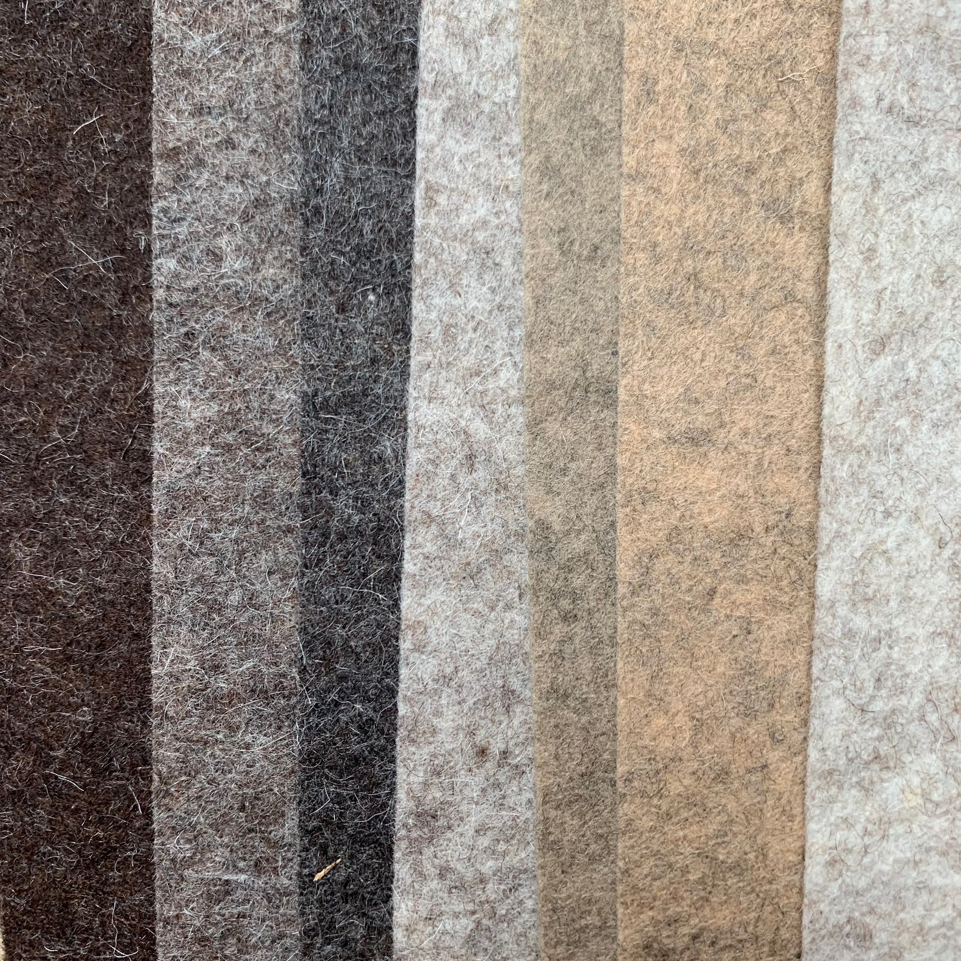 Mottled brown wool felt in seven shades from darkest to lightest brown