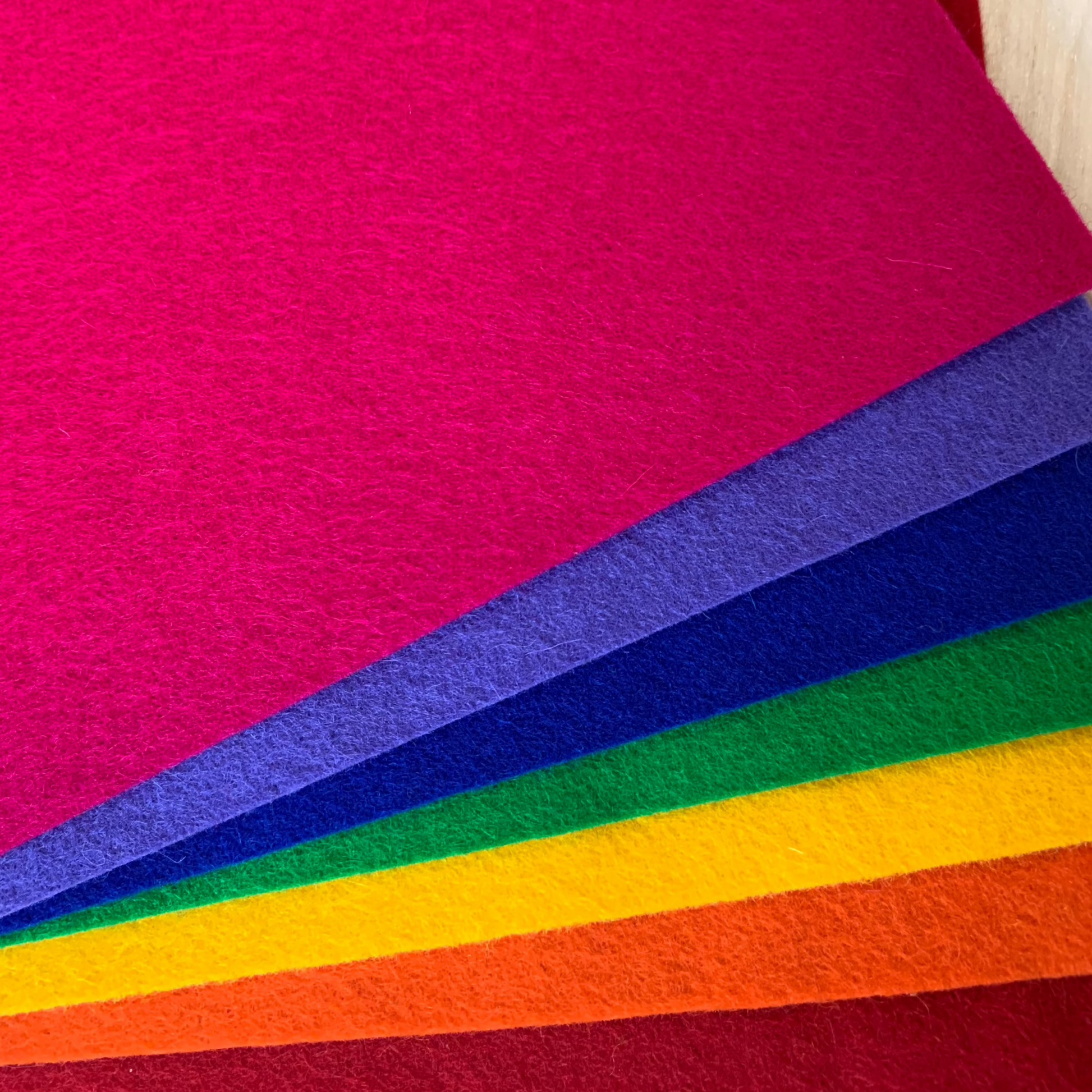 7 bright colours of wool felt in a rainbow of shades. Bright clear colours