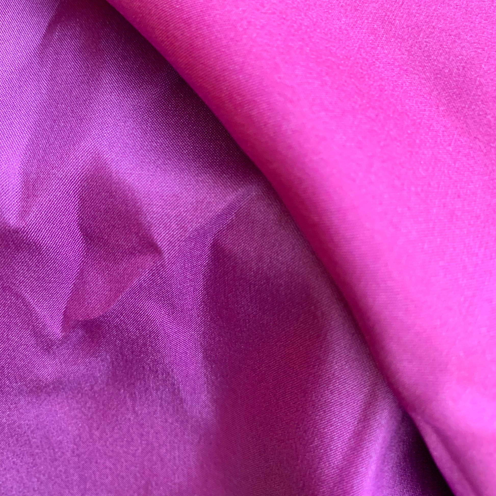 Close-up of purple and pink silk play cloth fabric
