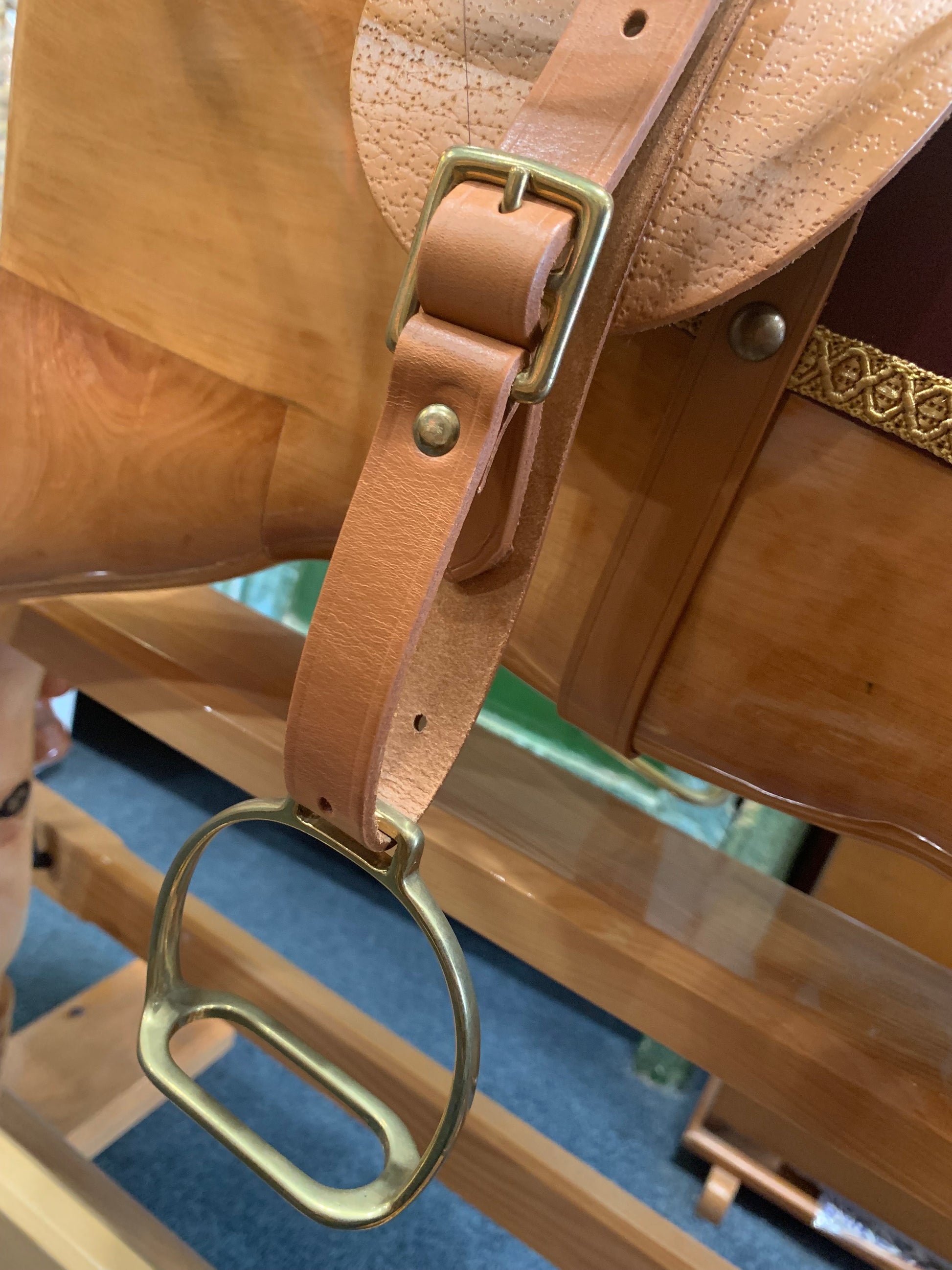 Rocking horses have solid brass stirrups and adjustable hand stitched leather strapping and saddle