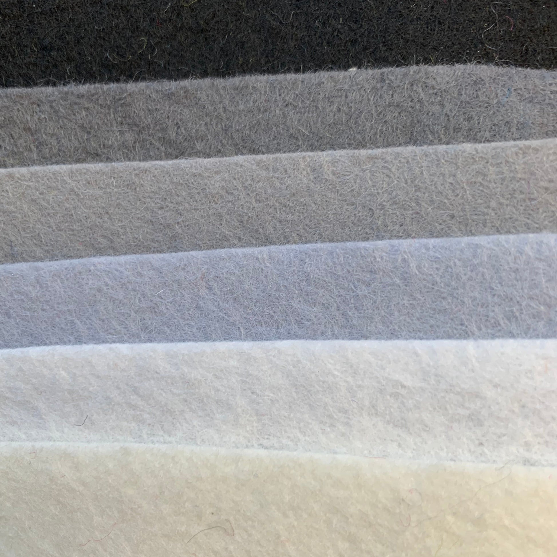 six shades of 100% pure wool felt from black, through greys and whites