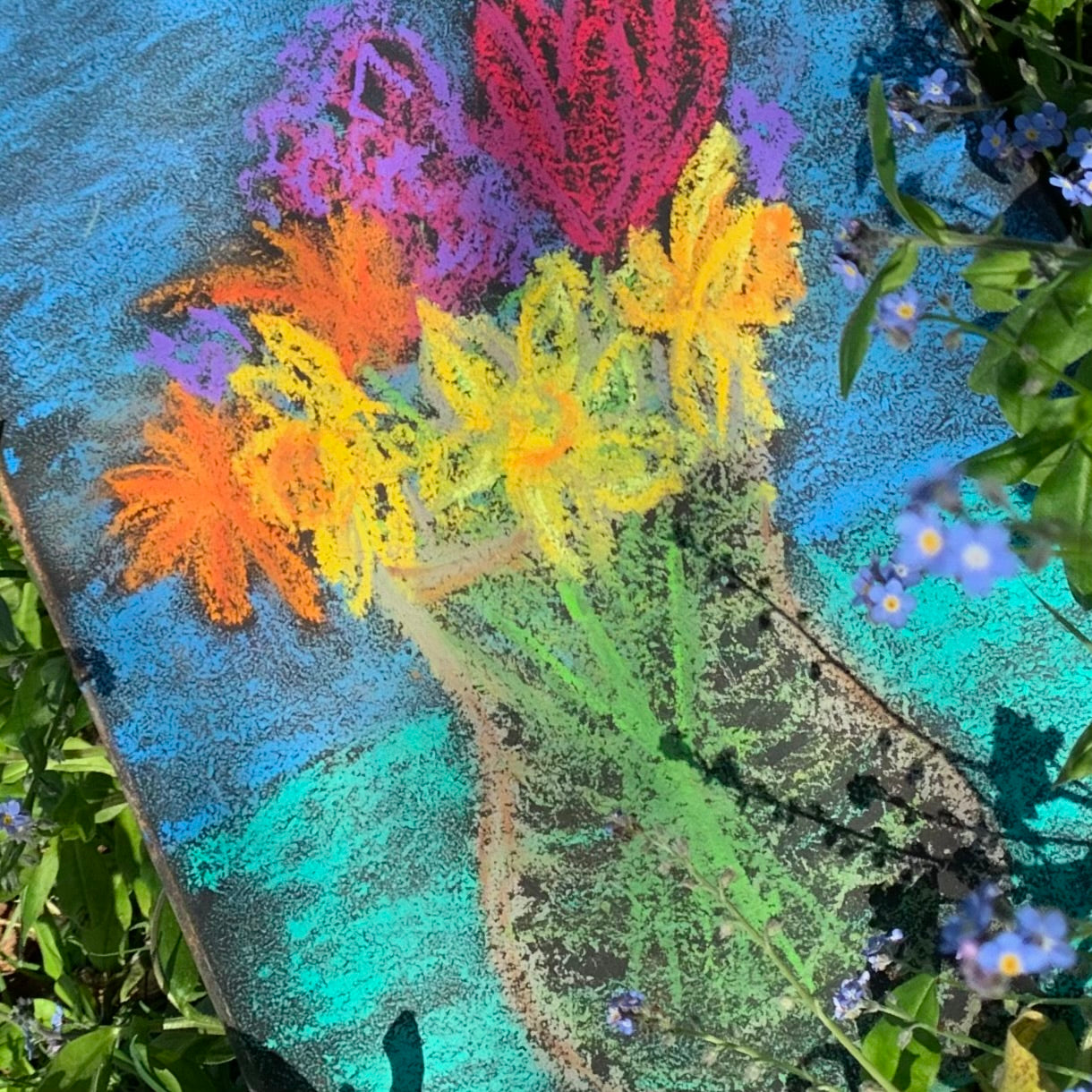 the rich vibrant colours of Apiscor in a blackboard drawing of colourful flowers in a vase.