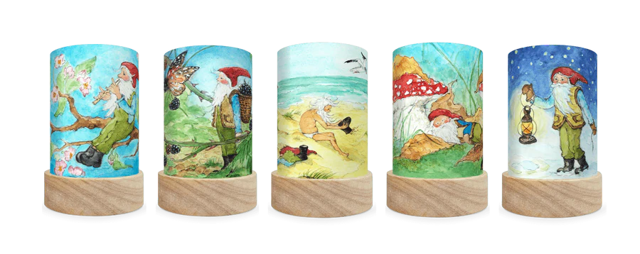 Five delightful lantern shades of a little gnome with a red hat in a variety seasonal