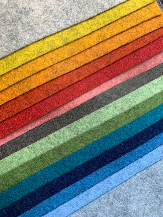 a selection of x15 shades of 100% pure wool felt in mottled (heathered) texture