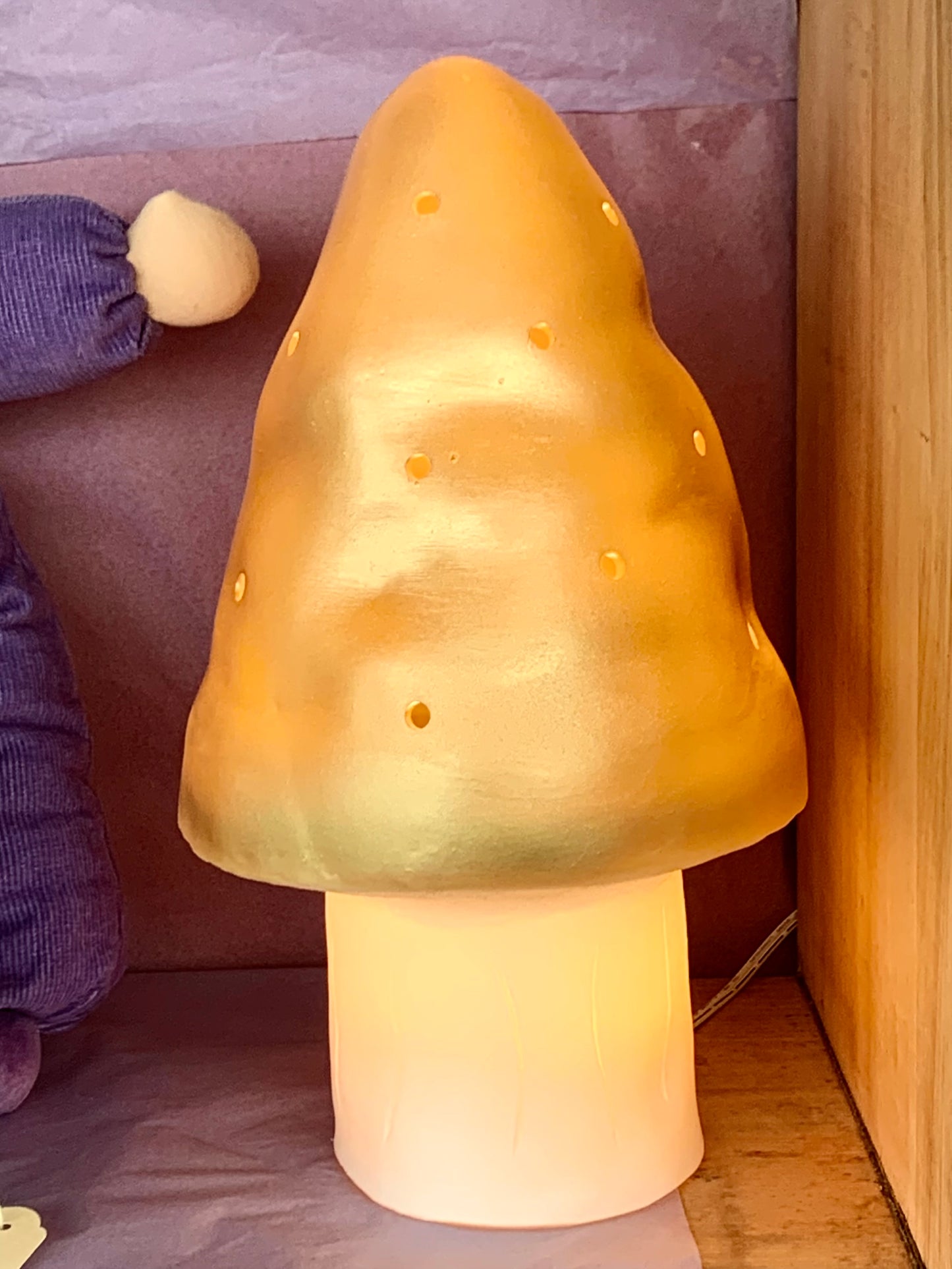 small gold mushroom lamp turned off 