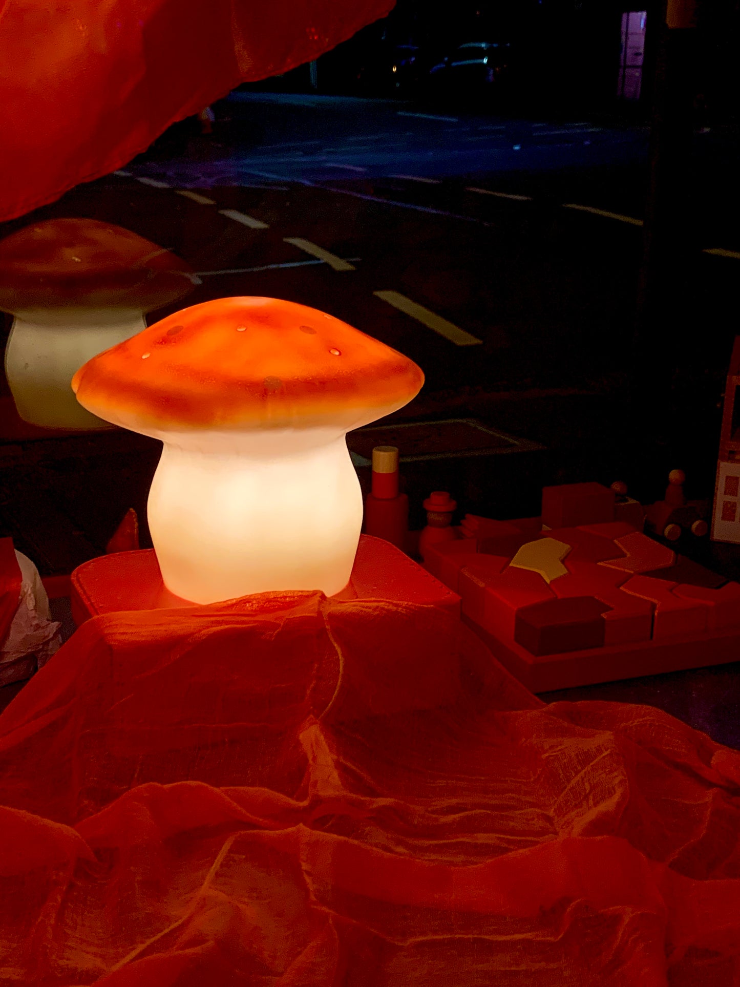 medium red mushroom lamp lit