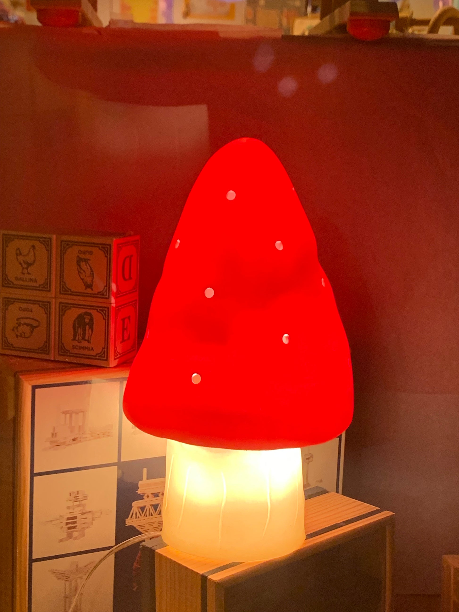 small red mushroom lamp lit up