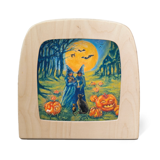 witches, pumpkins and bats under a full moon for Halloween on a Toverlux lamp silhouette screen