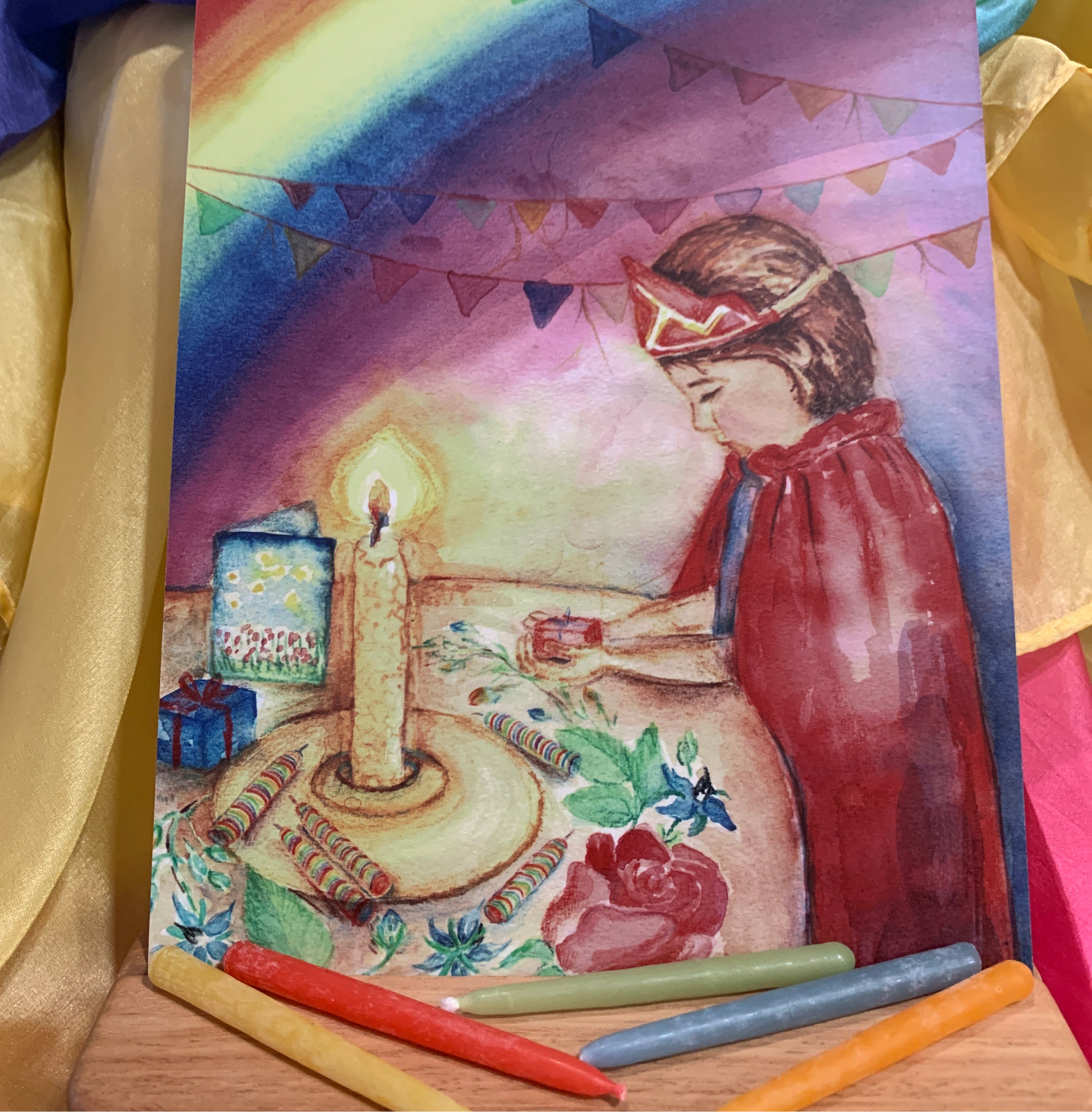 Birthday postcard and colourful wax candles 