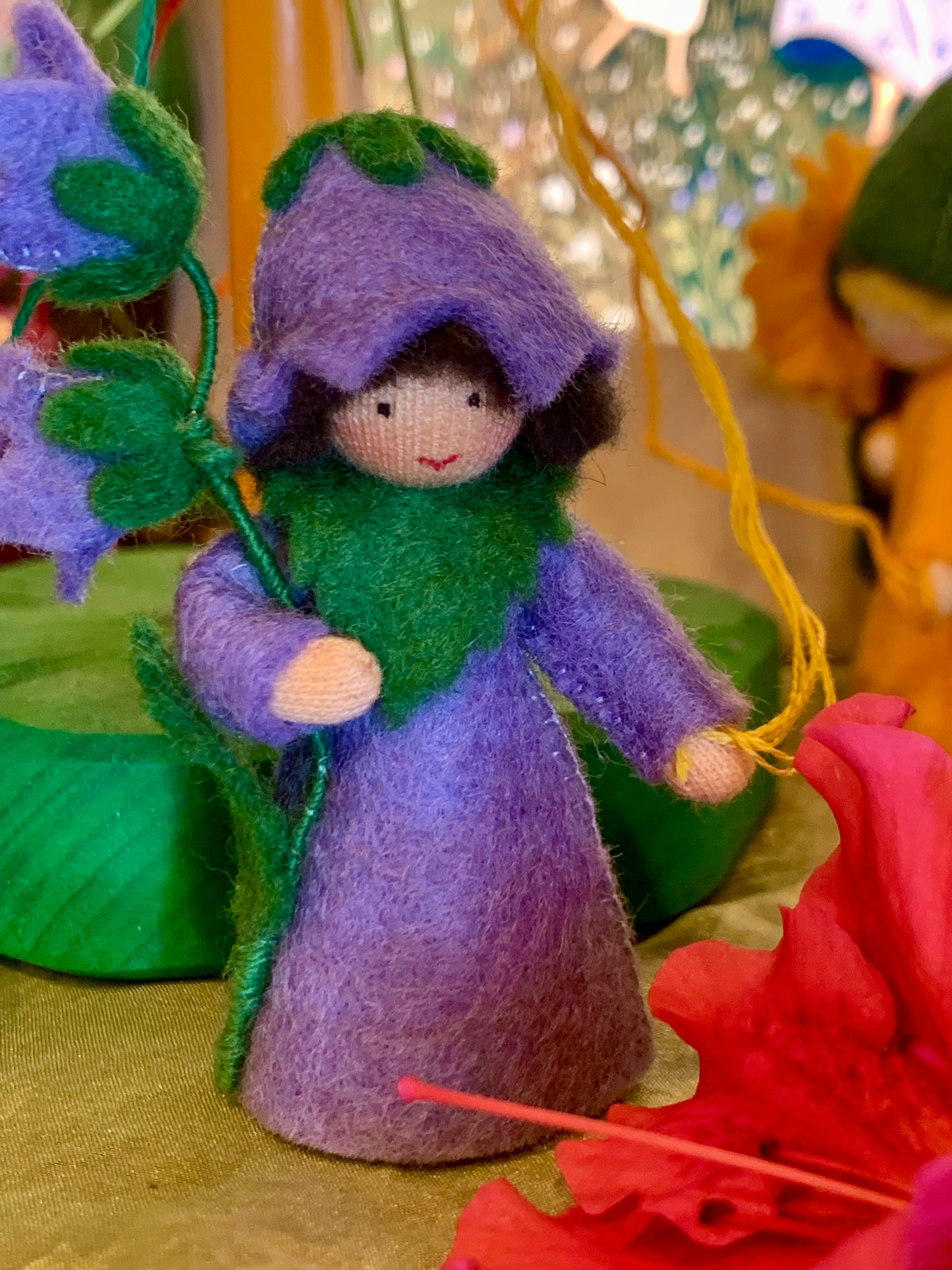 bluebell fairie holding a branch of bluebells