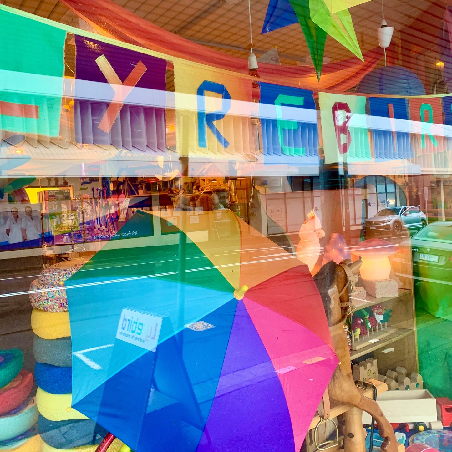 Colorful umbrella and decorations in a store window