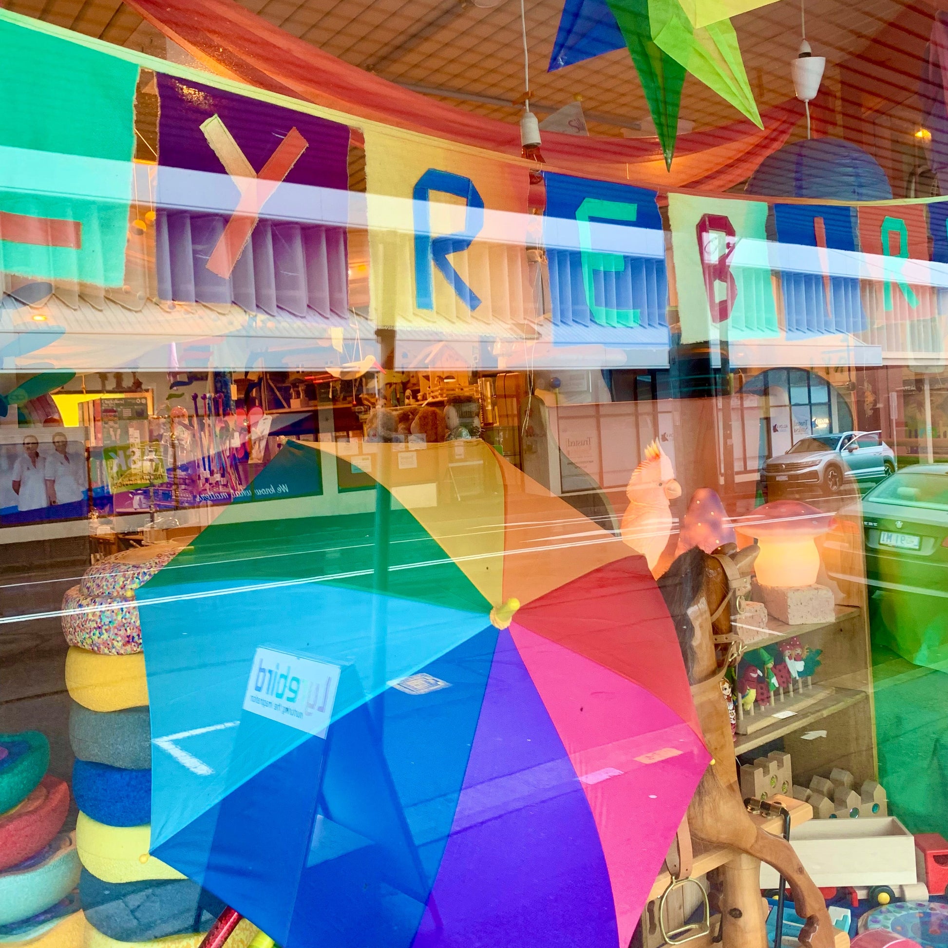 Colorful umbrella and decorations in a store window