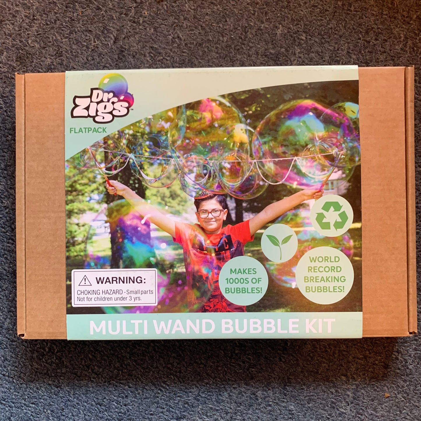 Dr. Zigs multi wand bubble kit packaging on a grey surface