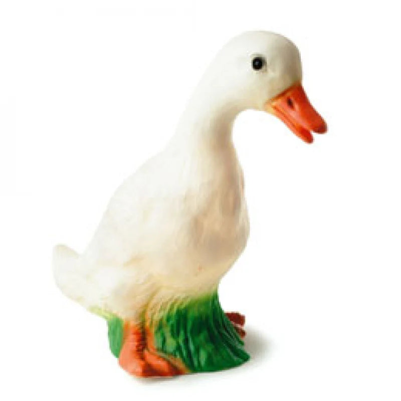 A sculpted lamp featuring a life-sized white duck with orange bill, painted green grass around base.