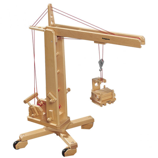 Wooden toy crane lifting cargo on a white background