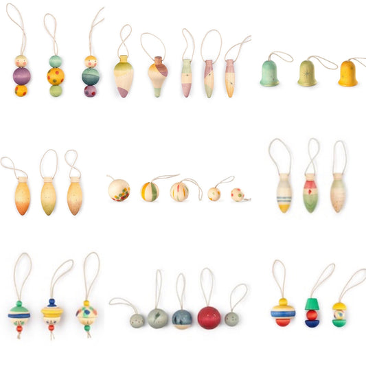 A set of colorful wooden hanging Christmas tree ornaments arranged on a plain white background. The collection includes teardrop-shaped hanging pieces,  bells, and round balls.  Natural wood shapes with painted accents.