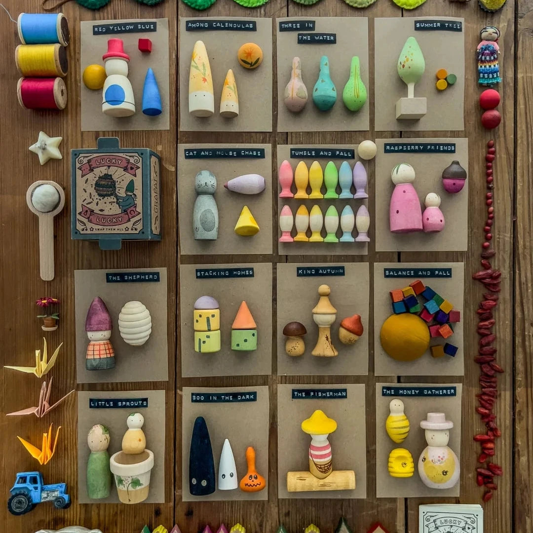 Collection of colourful figurines and on a wooden surface