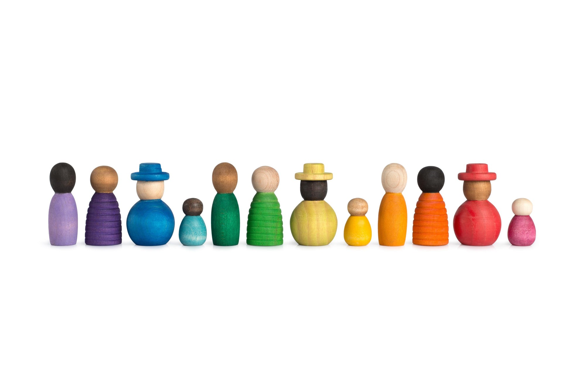 A set of handcrafted wooden peg dolls in various skin tones, sizes and body shapes arranged in a line.