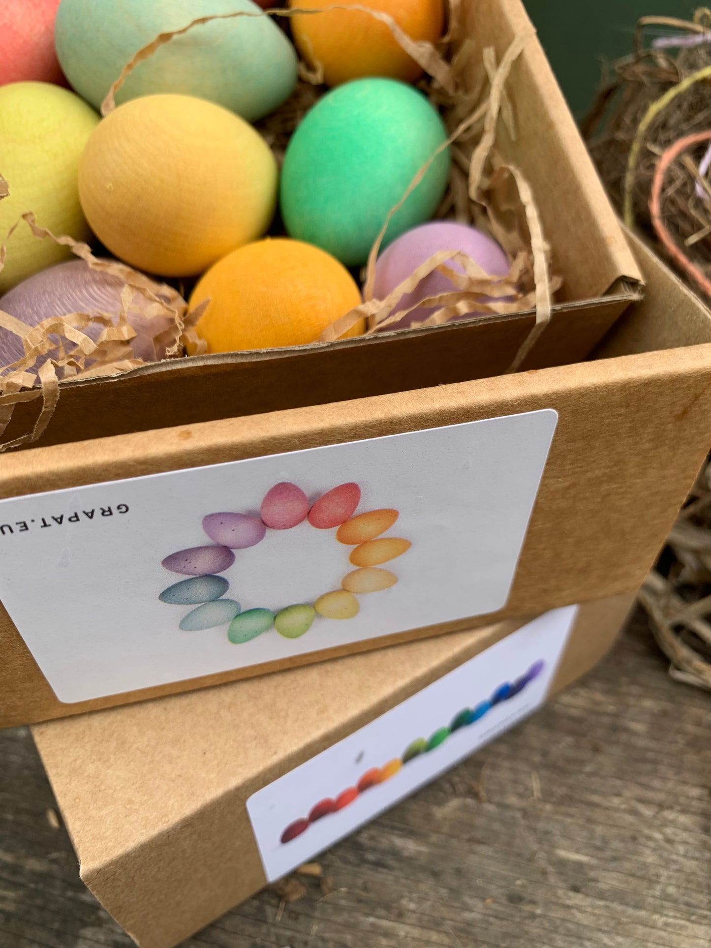 Cardboard boxes containing colourful handpainted Grapat Wooden Easter eggs 