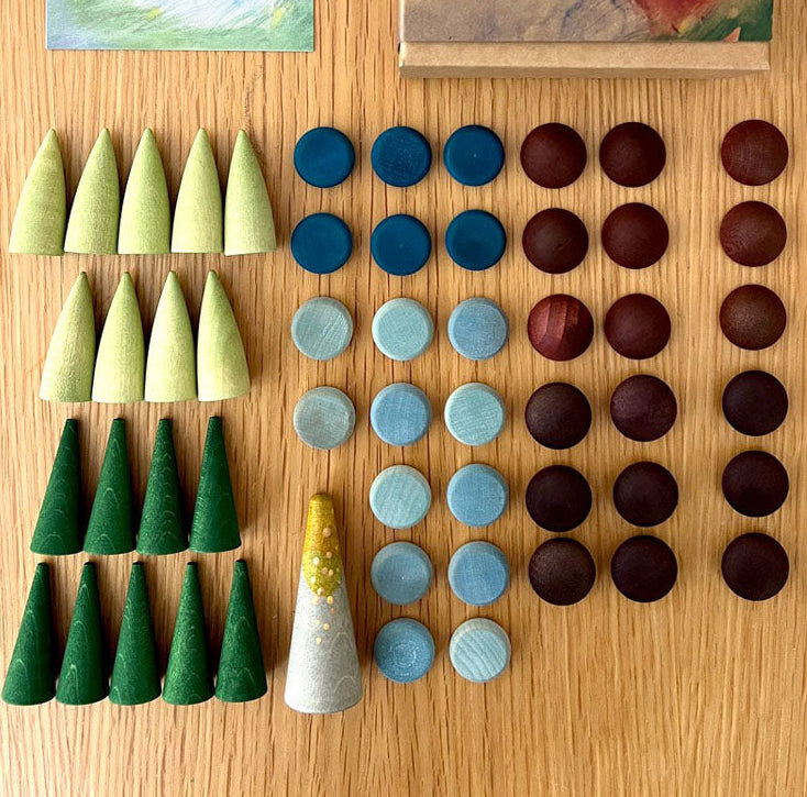 Play set of 55 wooden pieces to create landscapes 