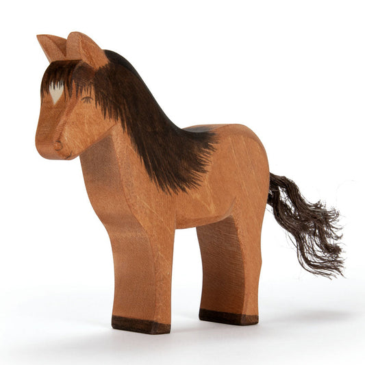 Wooden horse figure on a white background