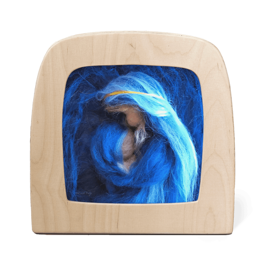 A picture made from wool felting of a Blue Madonna with a child 