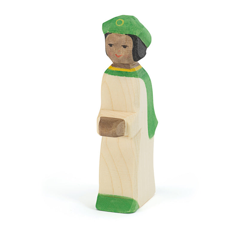 Wooden figurine of a page boy wearing a green hat and gown on a white background