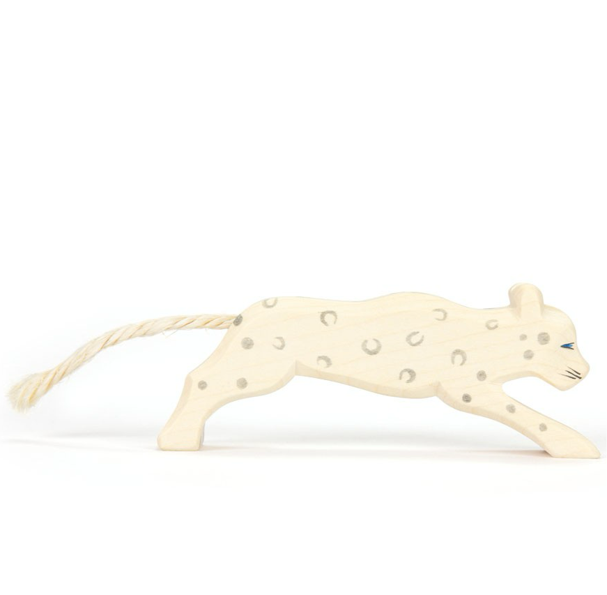 Wooden snow leopard figure with rope tail on white background