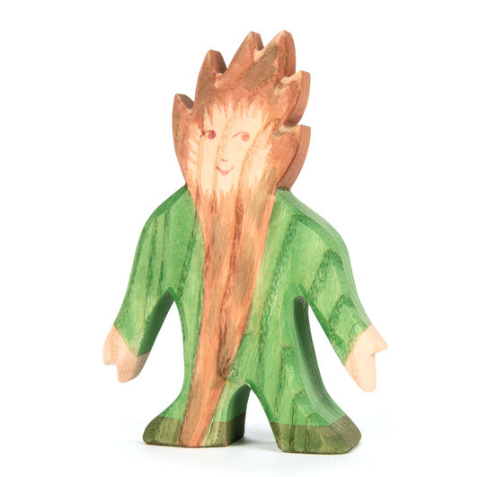 Wooden figurine of a troll character with a green body and brown hairt and long beard on a white background