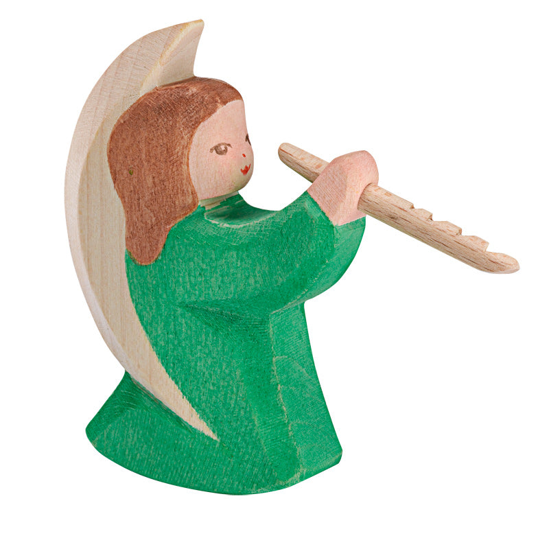Wooden figurine of a green angel on a rocking base holding a flute, 