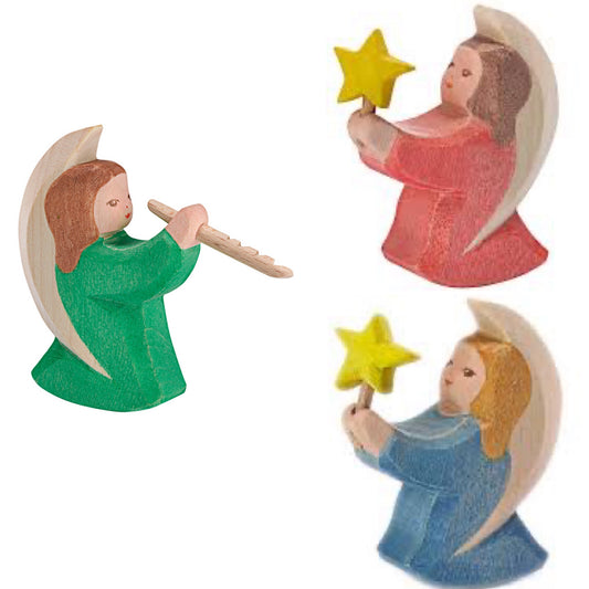 Three small wooden angel figurines, two holding stars and one  on a white backgroundolding a flute