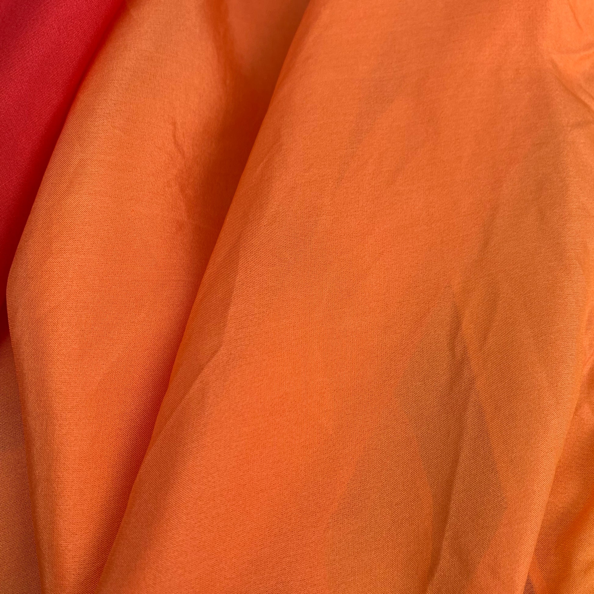 Close-up of orange silk fabric 