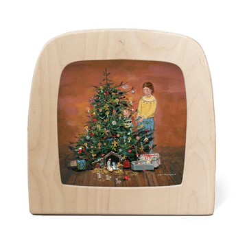 Wooden picture frame with a Christmas scene of a child decorating a tree.