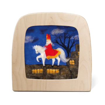 Saint Nicola on a white horse on a rooftop with dark night sky backdrop 