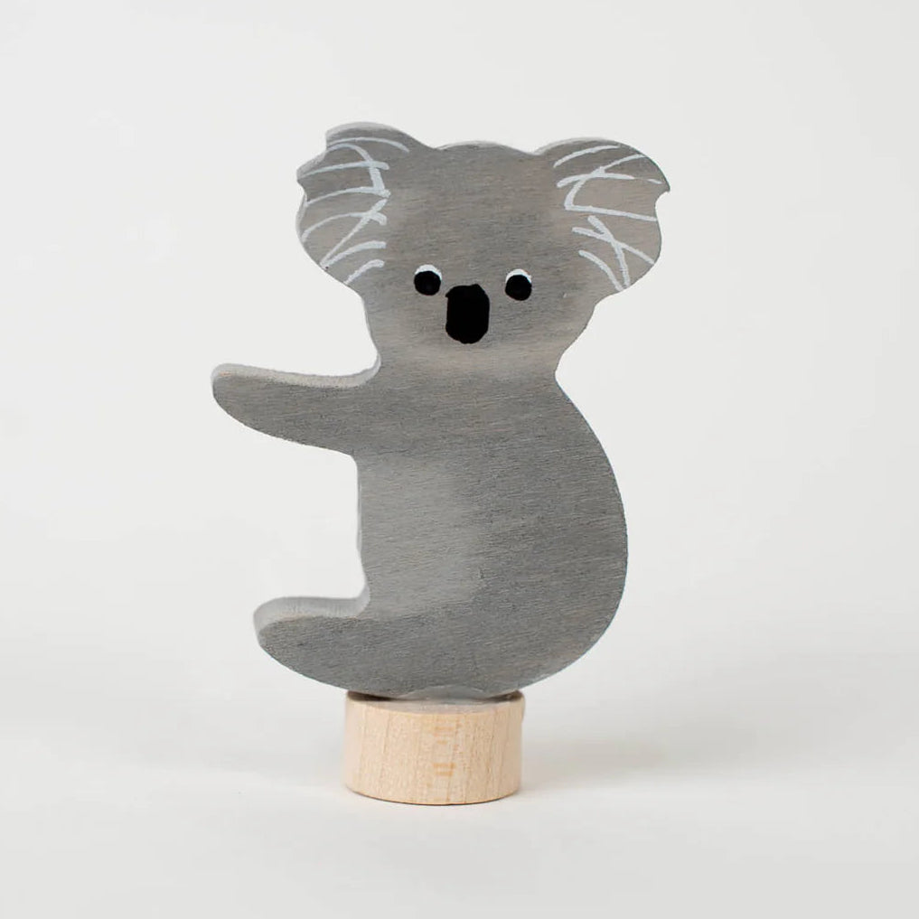 Wooden koala decoration on a white background
